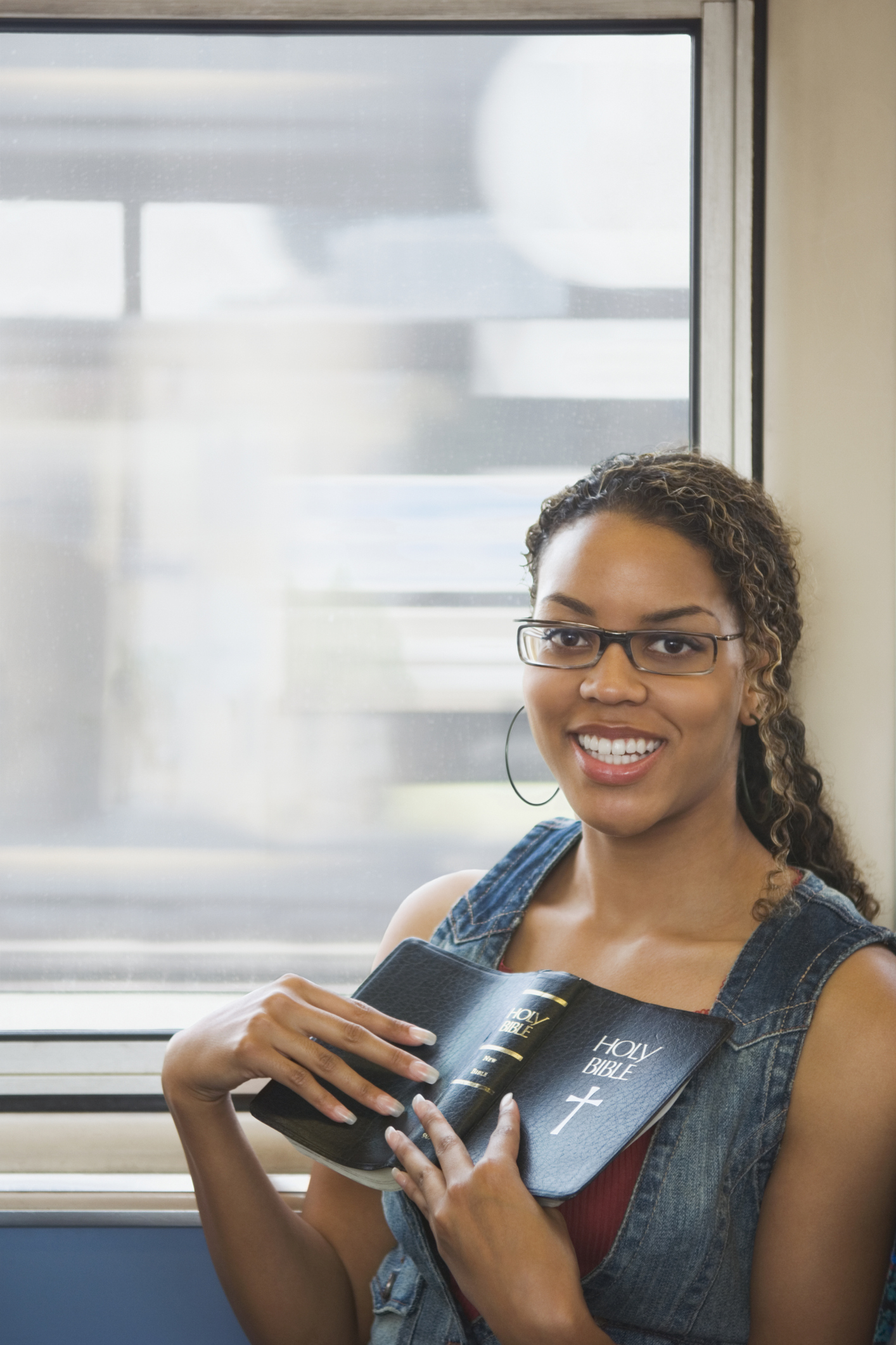 African woman holding bible