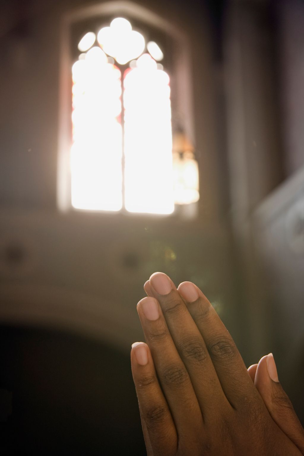 African lady praying in church