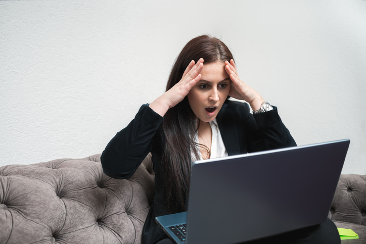 Young Woman Receiving Bad News Over E-Mail Stressful Work On Laptop