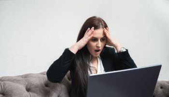 Young Woman Receiving Bad News Over E-Mail Stressful Work On Laptop