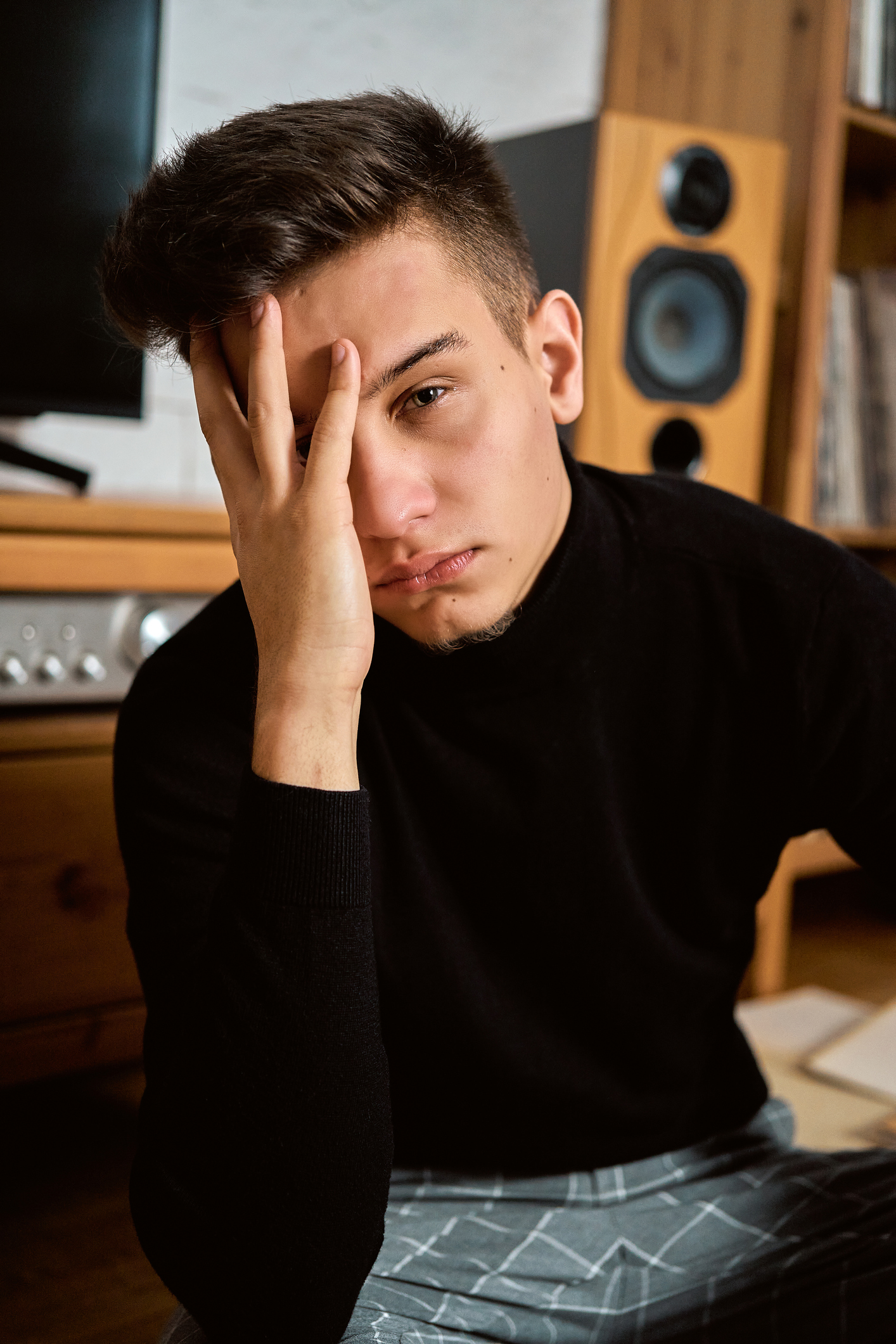 Portrait Of Young Man Sitting On Floor